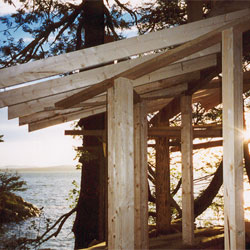 Sunset through rafters. Heather Johnston Architect